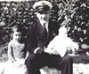 Lt William (Bill) Porte  holding daughter Jenny and sat next to daughter Pat